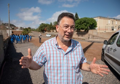 Antonio Rodriguez, a psychology professor of La Laguna university, speaks as migrant minors arrive to train on the Spanish island of Tenerife