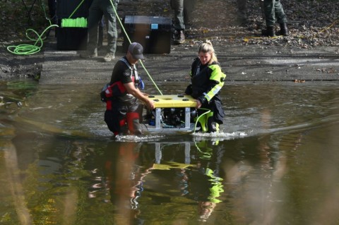 Divers prepare to search the Androscoggin River in Lisbon Falls, Maine, on October 27, 2023, in the aftermath of a mass shooting 