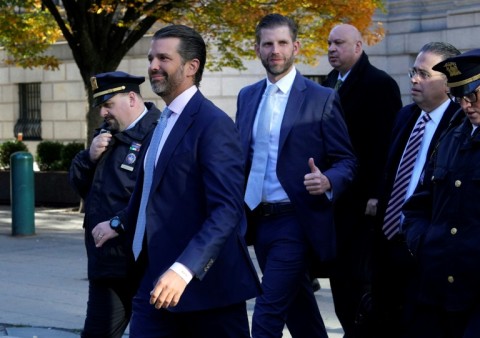 Donald Trump, Jr (2nd L) and Eric Trump (C) have both testified in their father's fraud trial