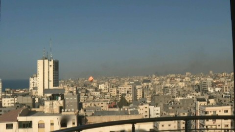 Building is hit by an Israeli airstrike in Gaza City