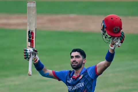 Hundred hero: Ibrahim Zadran celebrates after scoring Afghanistan's first World Cup century, against Australia in Mumbai