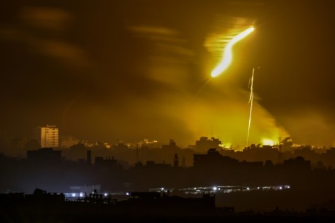 Flares fired by Israeli troops fly over the Gaza Strip 