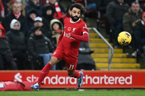 Liverpool star Mohamed Salah runs with the ball against Brentford at Anfield
