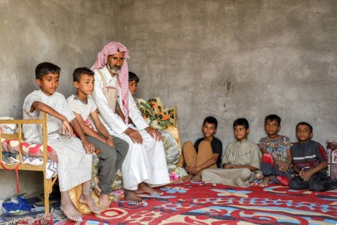 Nasser Jabbar at home with some of his 10 children
