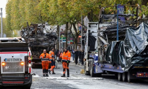 Workers clear debris after the worst violence 'in decades'