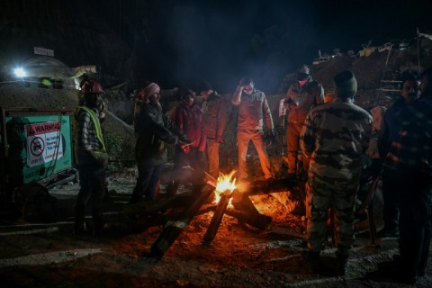 Rescue workers at the site, where temperatures have dropped