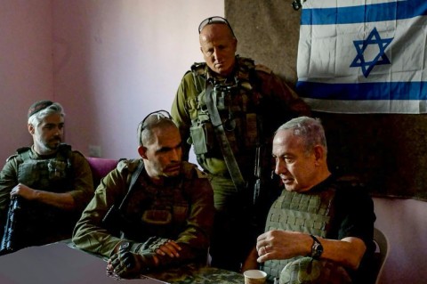 Handout picture from Israeli Prime Minister Benjamin Netanyahu's office of him meeting soldiers in the Gaza Strip