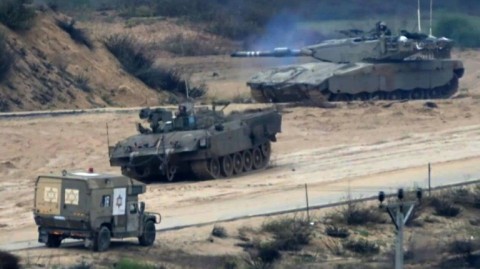 Israeli military vehicles manoeuver near near the Gaza border
