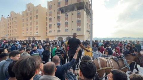Former hostage Bilal al-Zayadna is reunited with a relative after his release