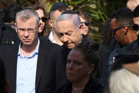 Israeli Prime Minister Benjamin Netanyahu (C) attends the funeral of Gal Eisenkot, the son of Israeli government war cabinet minister Gadi Eizenkot, killed in battles with Hamas militants in the Gaza Strip