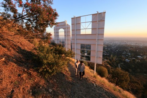 Back in 1923, the original wood sign said HOLLYWOODLAND and was used to advertise a swanky neighborhood