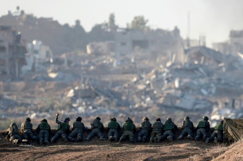Israeli soldiers on a hill overlooking northern Gaza