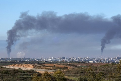 Smoke billows over the northern Gaza Strip during Israeli bombardment
