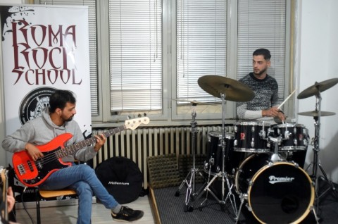 Music director Nevrus Bajram, left, plays in one of North Macedonia's most popular metal bands