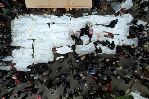 An aerial view of a mass funeral for the strike victims, at Al-Aqsa hospital in Deir Al-Balah, central Gaza