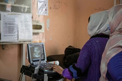 Nurses conduct an ultrasound test for a patient at the maternity hospital in Khost