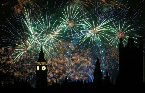 Fireworks explode around the London Eye and Big Ben in central London, just after midnight on January 1, 2024