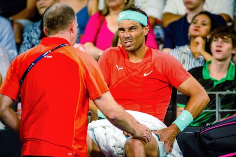 Pain game: Rafael Nadal receives medical treatment during his match against Australia's Jordan Thompson in Brisbane