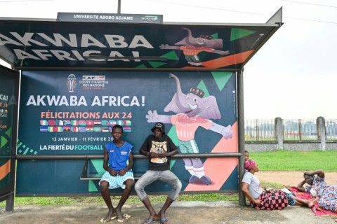 The Africa Cup of Nations official mascot appears on a bus stop in Abidjan
