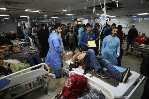 A wounded man awaits treatment at Al-Shifa hospital in Gaza City
