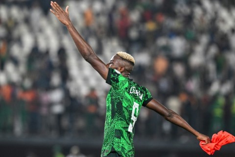 Star Nigeria forward Victor Osimhen salutes supporters after an Africa Cup of Nations last-16 win over Cameroon