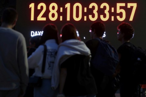 Relatives and supporters of Israeli hostages held in Gaza look at a screen showing showing the days, hours, minutes and seconds since the October 7 attack