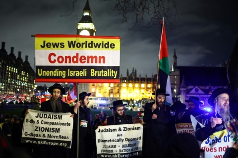 Members of the Ultra-Orthodox Jewish community protest in Parliament Square in London 