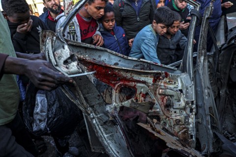 A car destroyed in a strike in Rafah in the southern Gaza Strip, on February 20, 2024