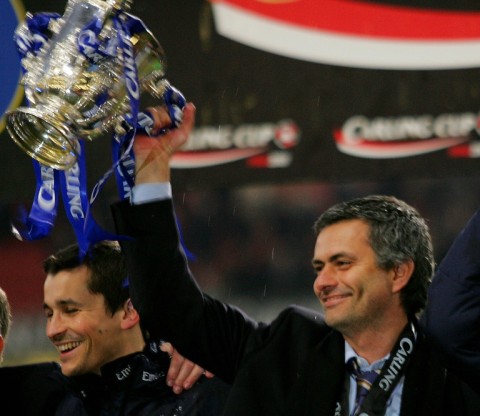 Chelsea manager Jose Mourinho raises the League Cup trophy in 2005