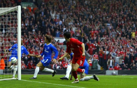 Liverpool's Luis Garcia (R) watches his shot head for goal