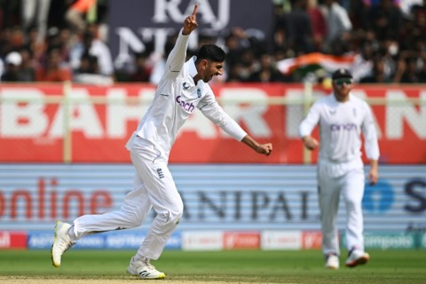 England's Shoaib Bashir celebrates his first Test wicket - India captain Rohit Sharma
