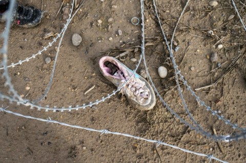 Razor wire and a shoe are seen near the Rio Grande at Shelby Park on February 3, 2024 in Eagle Pass, Texas. The park has been occupied by members of Texas National Guard and Texas Department of Public Safety. Border Patrol has been kept out of the park after agents tried to cut razor wire to access migrants who needed help.
