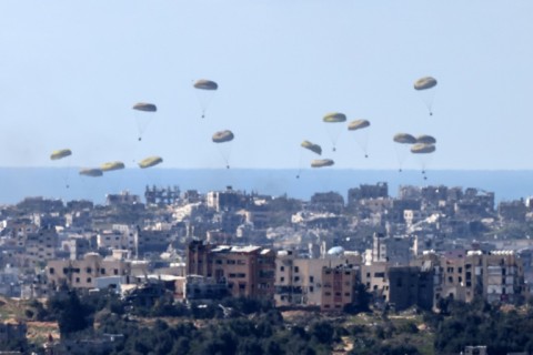 Humanitarian aid is airdropped over the Palestinian territory on March 10, 2024