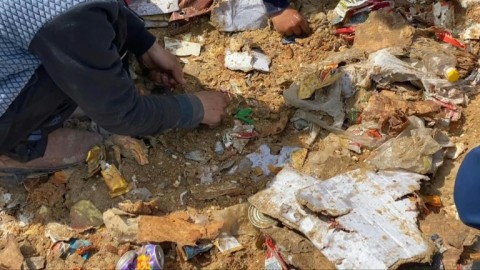Gaza City residents collect remnants of airdropped aid