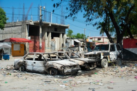 Charred vehicles in the street amid gang violence  in Port-au-Prince, Haiti, on March 9, 2024