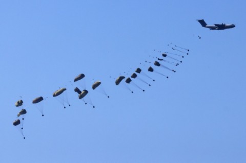 A member of the United Nations mourns over the body of a colleague at Al-Najjar Hospital in Rafah -- Israel said a strike killed a Hamas militant