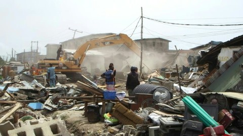 Nigerians look on as their Lagos neighbourhood is razed