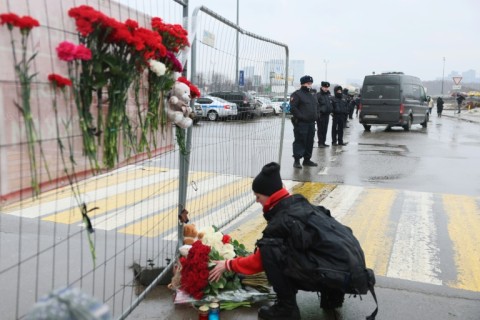 Flowers were laid outside a Moscow concert hall where at least 93 people were killed