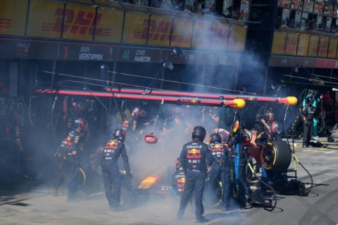 Smoke billows from Max Verstappen's Red Bull as he retires from the Australian Grand Prix 