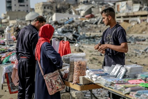 A vendor among the destruction of Gaza City -- the International Court of Justice said 'famine is setting in'