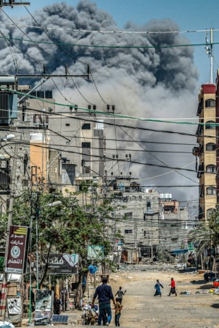 A cloud of smoke from an explosion in the central Gaza Strip on April 17, 2024 