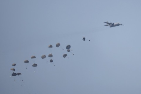 Humanitarian aid is airdropped over besieged Gaza, where the World Food Programme has warned famine is a 'real and dangerous threat'