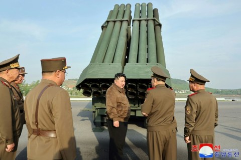 North Korean leader Kim Jong Un inspects the 240mm multiple rocket launcher system at an undisclosed location