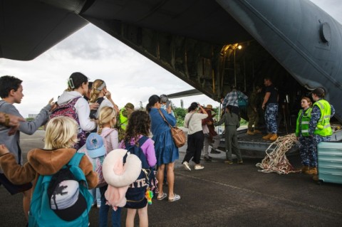 A Royal Australian Air Force C-130 Hercules aircraft evacuating people at Noumea-Magenta Airport in New Caledonia 