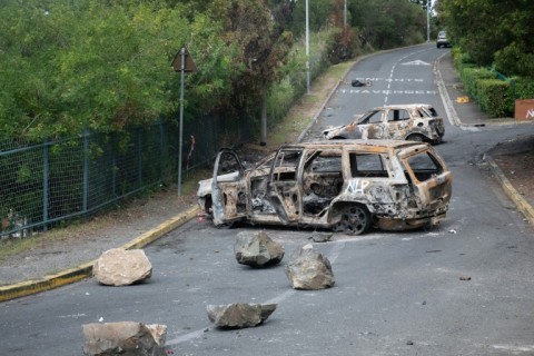 Burnt vehicles in the Magenta district of Noumea in France's Pacific territory of New Caledonia, on May 21, 2024