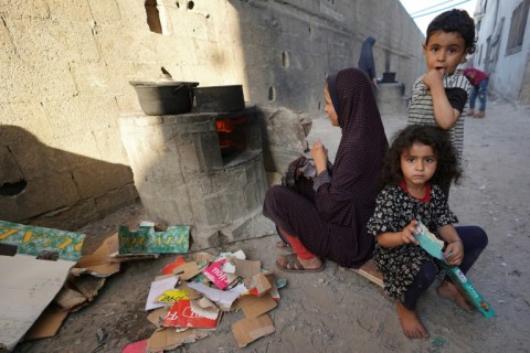 An Israeli helicopter fires a missile while flying over the Gaza Strip on May 15, 2024