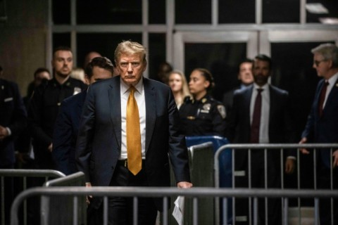 Former US president Donald Trump arrives to speak to the media at the end of the day's proceedings in his criminal trial at Manhattan Criminal Court