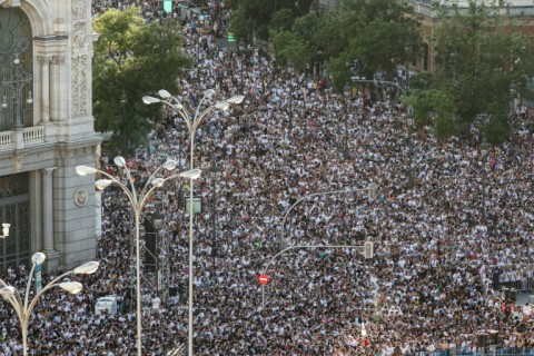Real Madrid fans crowd Cibeles square to celebrate their team's 15th Champions League trophy, one day after beating Borussia Dortmund