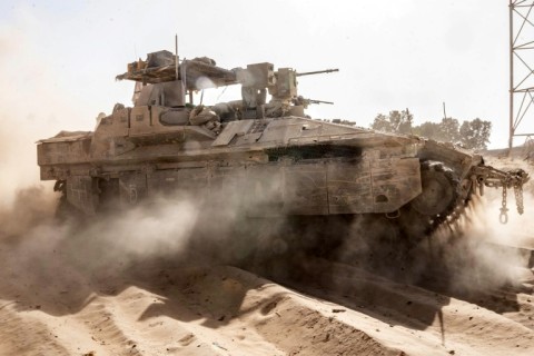 This handout picture released by the Israeli army on June 25, 2024 shows a tracked vehicle during operations in the Gaza Strip