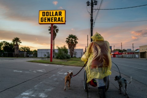 A homeless couple prepares to seek shelter on July 7, 2024, ahead of Beryl's arrival in Corpus Christi, Texas